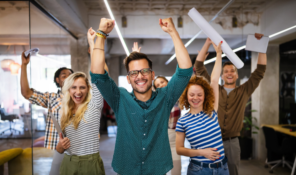 A group of happy people in a work environment because they had a seamless drawing conversion process with CAD Redraw Experts